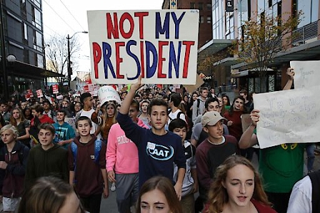 Local students and their supporters march during a walkout protest against US President-elect Donald Trump in Seattle, Washington on November 14, 2016